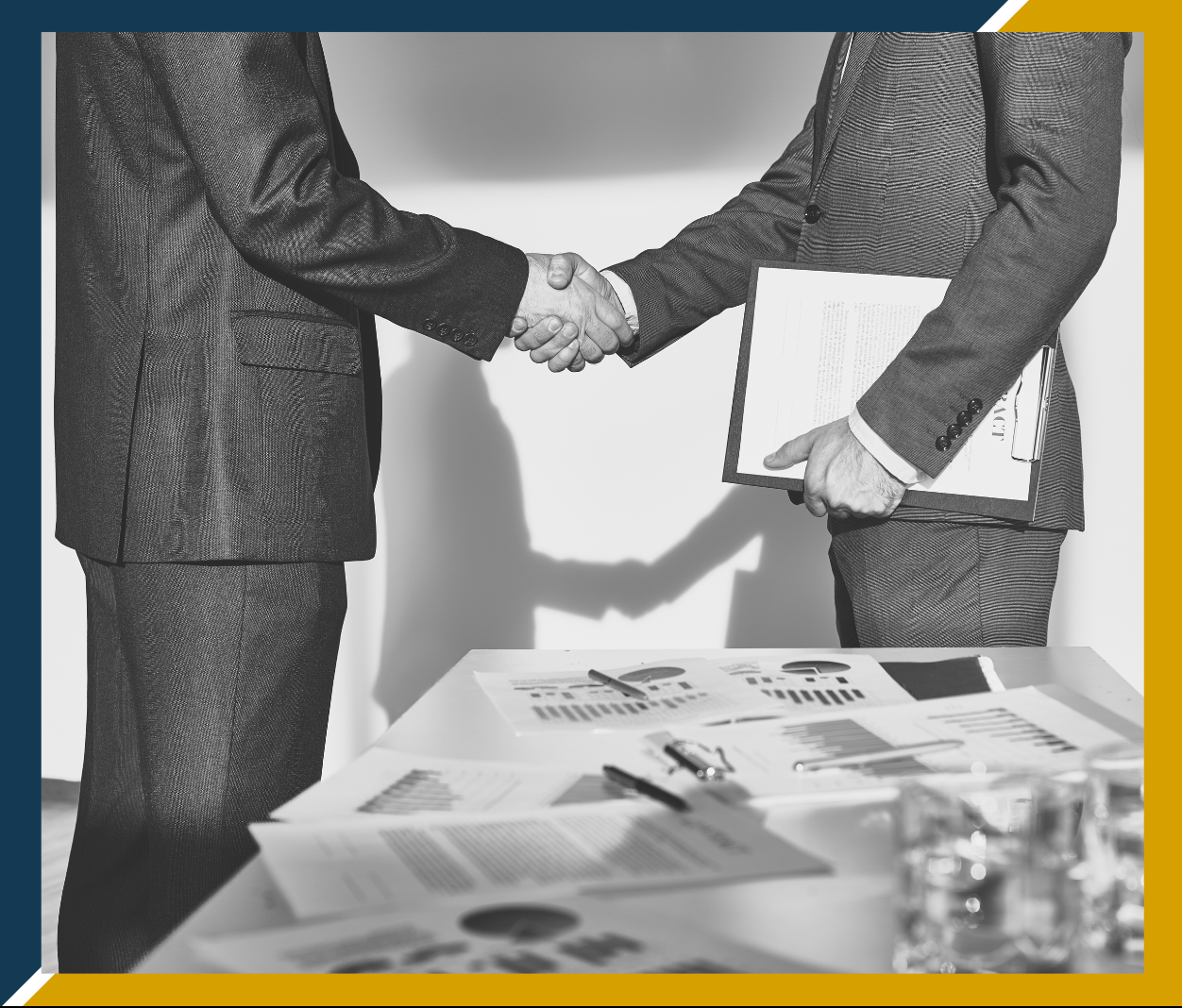 black and white image of two business people shaking hands
